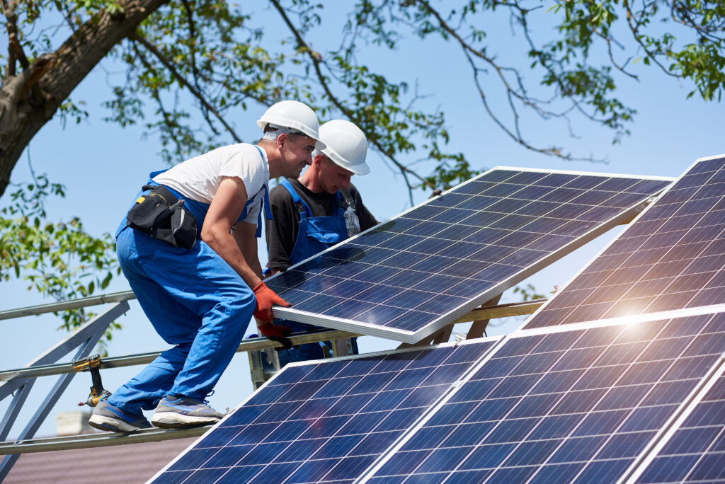 A team of professionals installing solar panels.